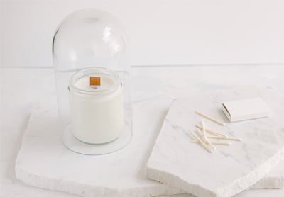 Candle under a glass cloche
